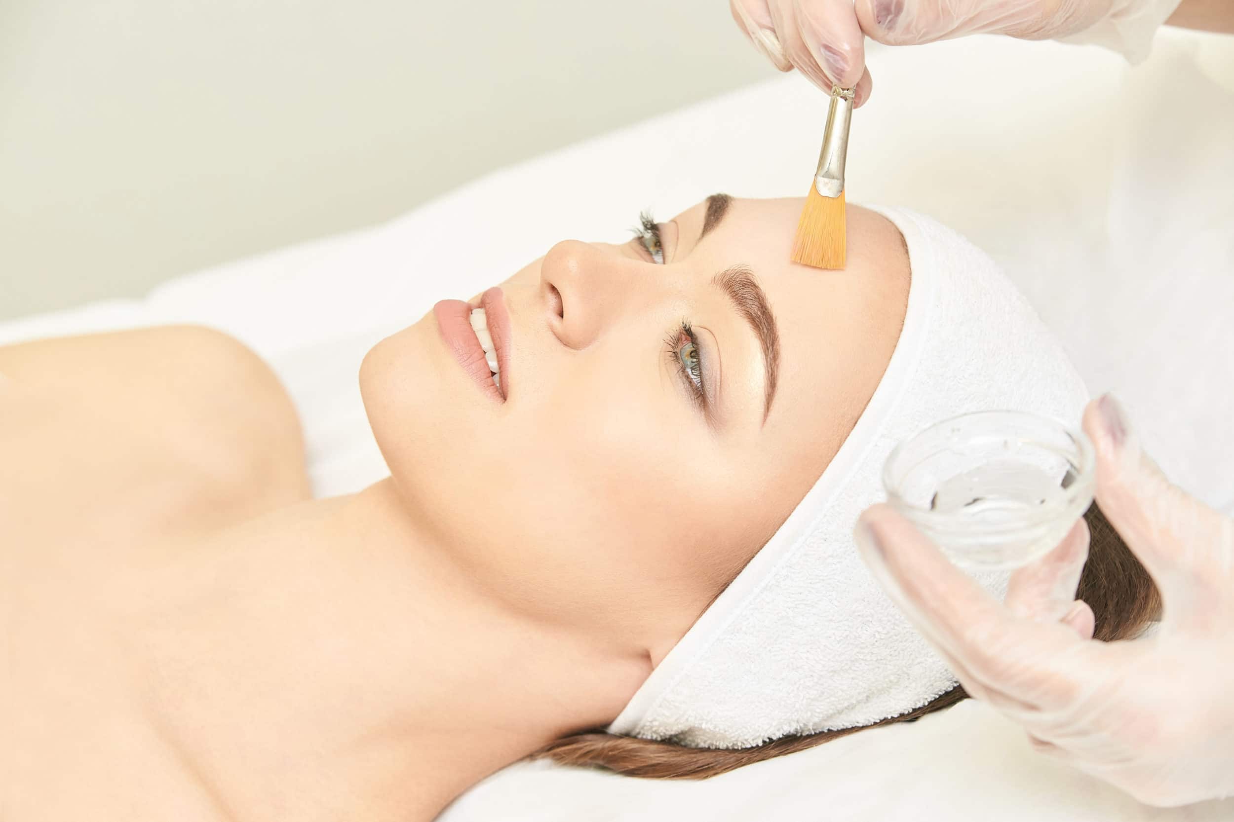 A woman getting a chemical peel treatment.